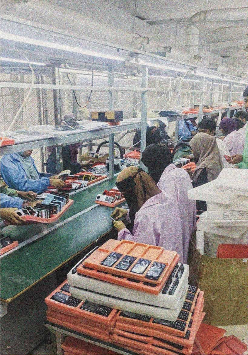 Workers assembling devices at a finished-product assembly line