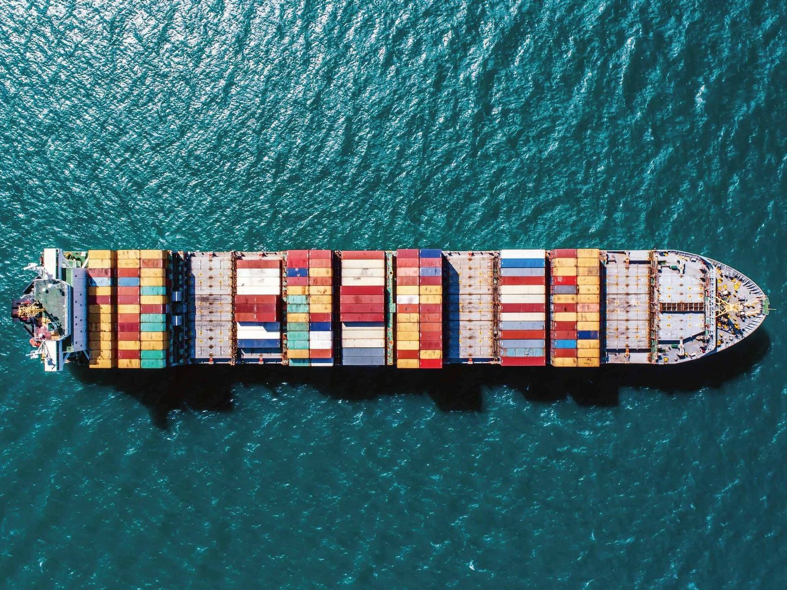 Aerial view of a fully loaded container ship at sea