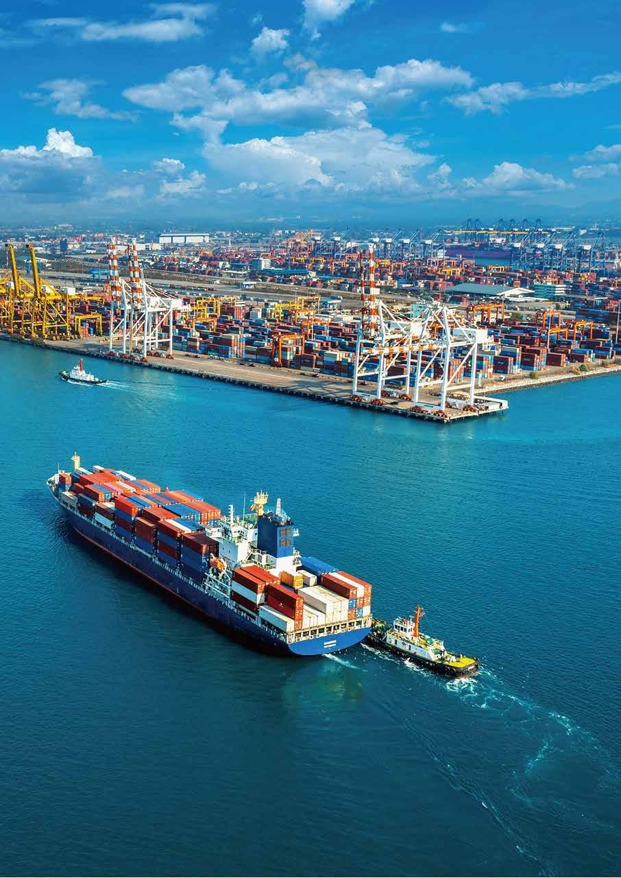 Container ship departing a busy shipping port